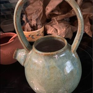 Handmade pottery pitcher signed